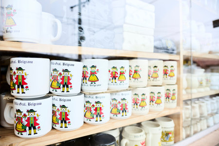 Villa General Belgrano, Cordoba, Argentina; Aug 20, 2024: Souvenir store window display selling beer mugs with German style designs, very popular in this touristic town of Central European tradition.のeditorial素材