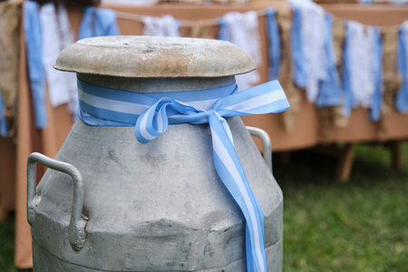 Old canteen with a ribbon with the Argentine flag, decoration during the celebration of a national holiday in Argentina.の写真素材