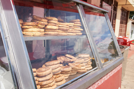 Arepas boyacenses exposed for sale in a showcase, traditional Colombian food made from corn and wheat flour, stuffed with cheese.の写真素材