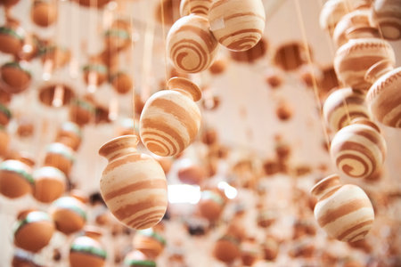 Decorative hanging ornaments with ceramic pots, traditional handicraft of Raquira, Colombia, a town known for its pottery.の写真素材