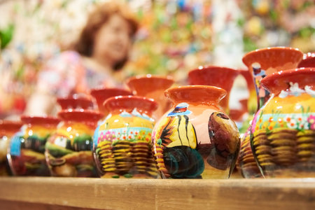 Sale of handmade ceramic vases painted with colorful traditional scenes, in Raquira, Colombia, town known for its handicrafts and pottery.の写真素材