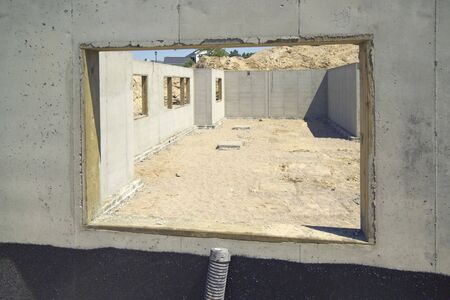 Window view of a new home foundation. (14MP camera)の写真素材