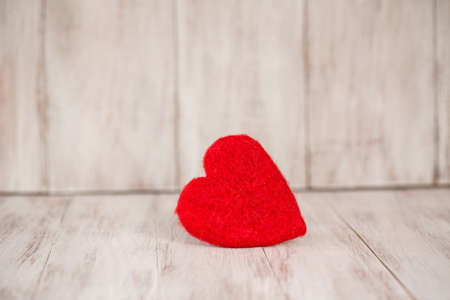 Red Valentines Day heart on vintage wood の写真素材