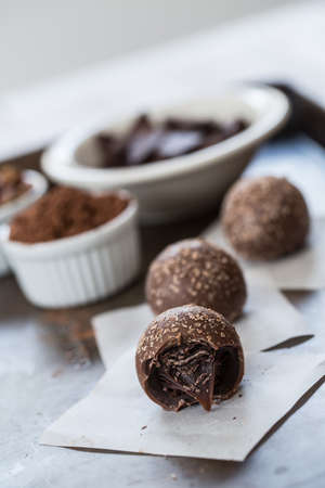 Chocolate truffles with cocoa powder and chocolate piecesの写真素材