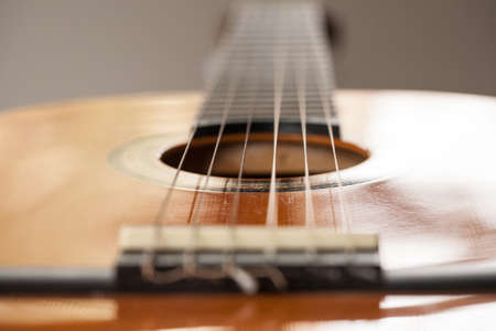 Close up macro of wood acoustic guitar for playing musicの写真素材