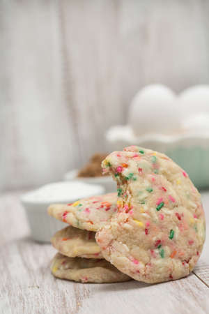 Confetti cookie with bite taken out with eggs and sugars