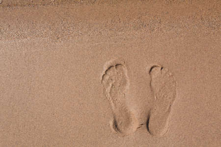 Close up of footprints in sand on Lake Michigan beach