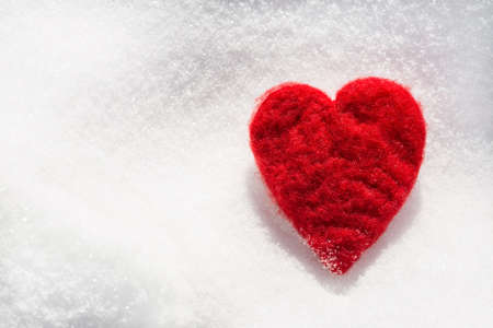 Valentines Day love heart in winter in the snow from aboveの写真素材