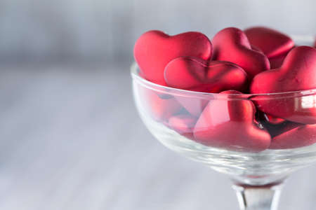 Valentines Day hearts love symbols close up in wine glassの写真素材