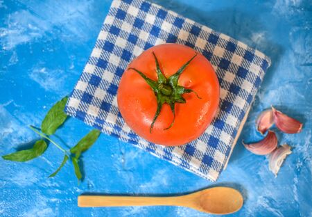 Tomato on blue wood Backgroundの写真素材
