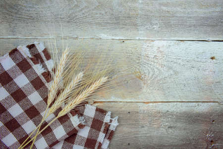 Wheat spikes on Wooden Tableの写真素材