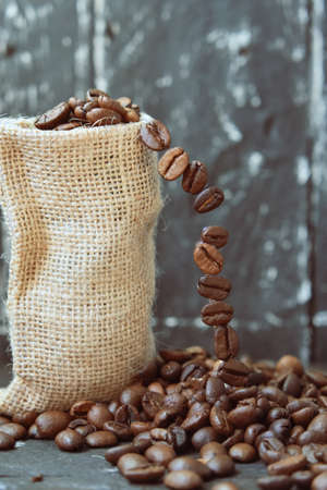 Coffee beans on wooden Close Upの写真素材