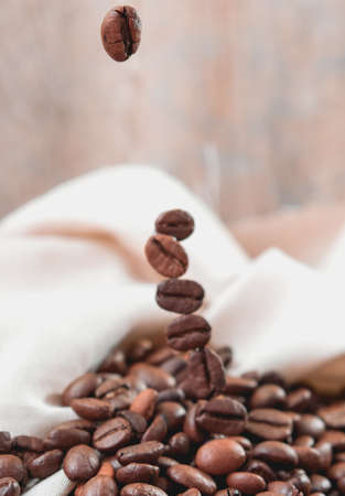 Coffee beans on wooden Close Upの写真素材