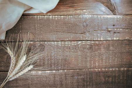 Wheat spikes on Wooden Tableの写真素材