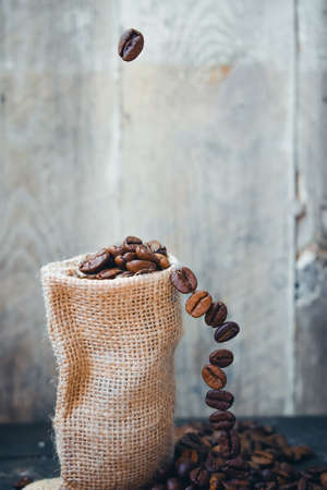 Coffee beans on wooden Close Up Photographyの写真素材