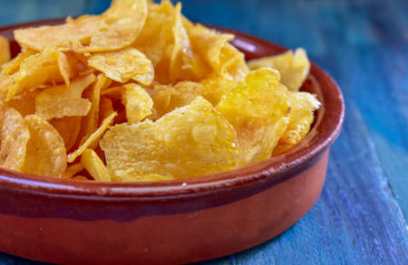 Potato Chips With Ketchup on woodenの写真素材