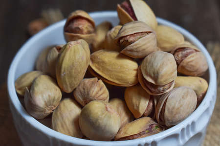 Pistachios on wooden Table Background