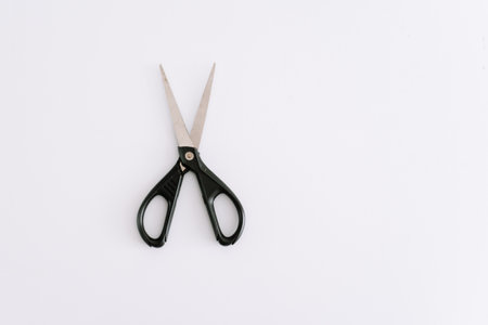 A pair of scissors on white backgroundの写真素材
