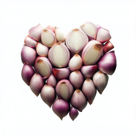 Shallot onions arranged in a heart shape on a white backgroundの素材