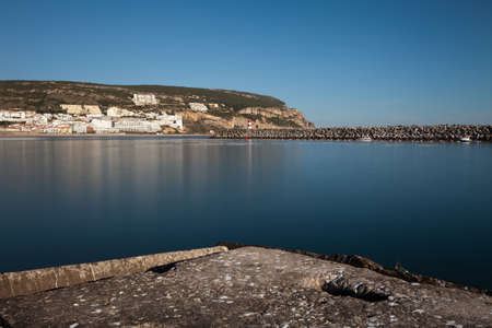 Lighthouse in port. Sesimbra, Portugal.の写真素材