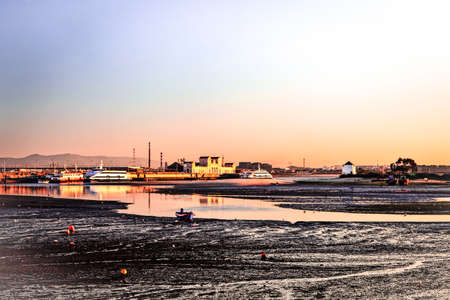 Sunset on the Tejo river with Barreiro mills in background の写真素材