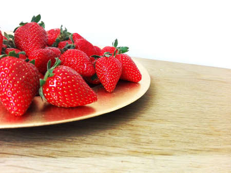 Fresh strawberries on a wooden tableの写真素材