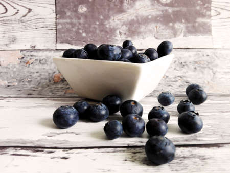 Fresh blueberries on a wooden tableの写真素材