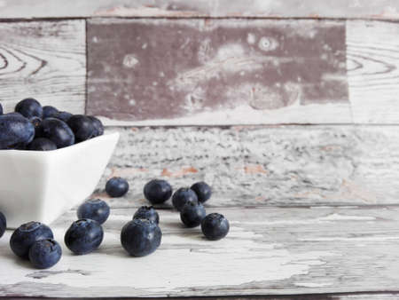 Fresh blueberries on a wooden tableの写真素材