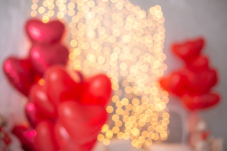 Valentines day greeting card. Soft image abstract bokeh dark red with light background. soft hearts around the edgesの写真素材
