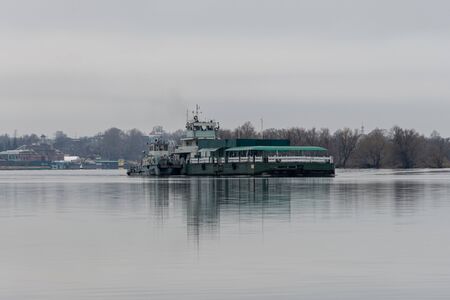Tver region, Volga river Russia - 28 04 2017: cargo ship River ship P-219 floats right to left on the river, front side view on the background of the forest shoreのeditorial素材