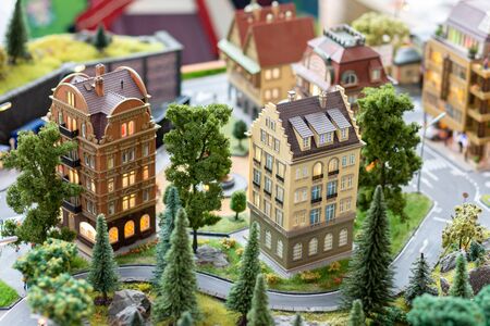 Miniature building model objects with roads and treesの写真素材