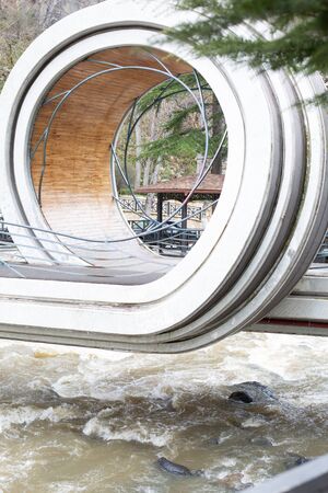 Unusual bridge across a river in Borjomi city, Georgia.