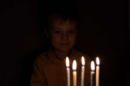 Adorable five year old kid celebrating his birthday
