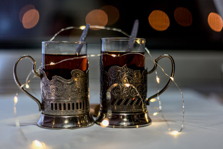 Two glasses of tea in retro teacups on a train. Travel concept.の写真素材
