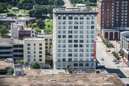 Aerial view of a modern apartment building in the middle of a cityの写真素材