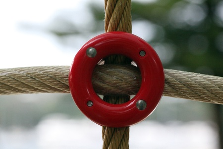 Rope connected by a red plastic bolt.の写真素材