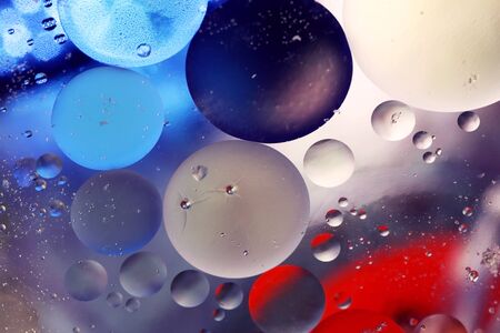 Colored bubbles of oil mixed with water