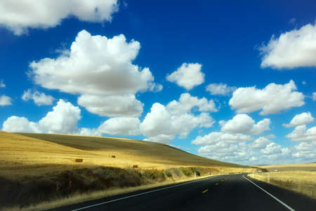 beautiful road with blue sky on backgroundの写真素材