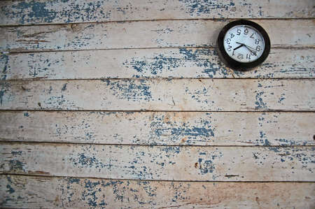 broken clock on a decaying wall