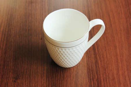 Empty Coffee cup on wooden table stock photoの写真素材