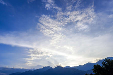 Mountain landscape at sunset time, with the rays of the sun.の写真素材