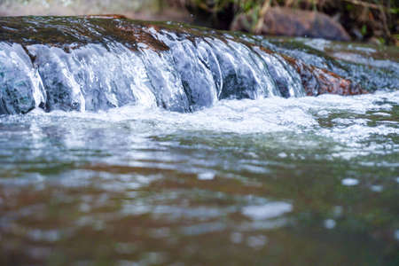 water flow over the rocks . waterfalls inside forest