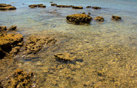 big stone in transparent ocean water Koh Lanta Thailand selective focusの写真素材