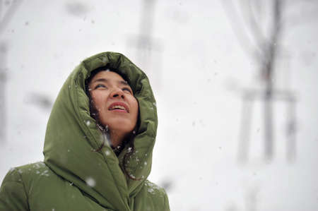 A woman who is looking at snowの写真素材