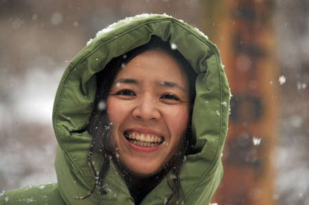A smiling woman on snowy day