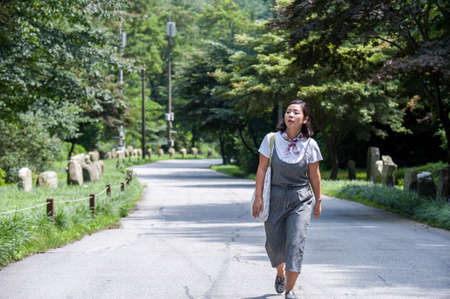 Asian woman walkingの写真素材