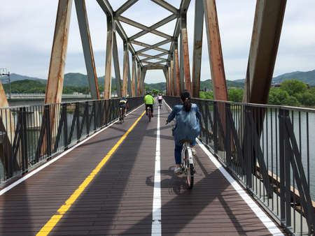 Riding bicycle on the bridgeの写真素材