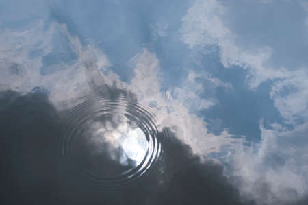 Sky reflected in pondの写真素材