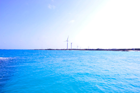 wind turbine in the blue sea, closeup of photo with soft focus