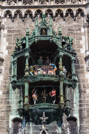 The Glockenspiel in the tower of the new city hall with different figures is a famous tourist attraction in Munichのeditorial素材